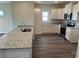 Modern kitchen with white cabinets, granite counters, and stainless appliances at 158 Grissett Lake Dr., Conway, SC 29526