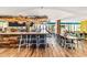 Long wooden bar features bar stool seating, overhead lighting, and multiple televisions at 2401 S Ocean Blvd. # 1156, Myrtle Beach, SC 29577