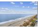 Wide view of the beach, ocean, and coastline with vegetation at 2401 S Ocean Blvd. # 1156, Myrtle Beach, SC 29577