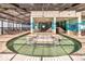 Indoor swimming pool with bridge access and ocean-themed mural on the wall at 2401 S Ocean Blvd. # 1156, Myrtle Beach, SC 29577