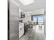 Modern kitchen with stainless steel appliances, white cabinets, and an adjacent dining area at 2401 S Ocean Blvd. # 1156, Myrtle Beach, SC 29577