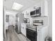Updated kitchen featuring stainless steel appliances, modern white cabinets and hardware at 2401 S Ocean Blvd. # 1156, Myrtle Beach, SC 29577