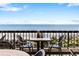 Bistro table with two chairs offering a scenic ocean view, ideal for relaxing and enjoying the coastal atmosphere at 2401 S Ocean Blvd. # 1156, Myrtle Beach, SC 29577