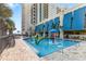 Outdoor resort-style water park with ' splash area and a high-rise tower in the background. Fun for the whole Gathering at 2401 S Ocean Blvd. # 1156, Myrtle Beach, SC 29577