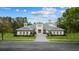 Exterior of a luxurious, two-story home with a tile roof and landscaped yard at 9185 Marina Pkwy., Myrtle Beach, SC 29572