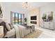 Main bedroom with fireplace, large windows, and views of pool and backyard at 9185 Marina Pkwy., Myrtle Beach, SC 29572