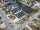 Aerial shot of a charming blue home situated on a waterfront canal in a residential neighborhood at 2307 Tortuga Ln., North Myrtle Beach, SC 29582