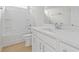 A bright, modern bathroom with white fixtures, a vanity, and a shower-tub combination at 2307 Tortuga Ln., North Myrtle Beach, SC 29582