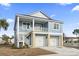 Charming two-story coastal home with a two-car garage and a lovely second-story balcony at 2307 Tortuga Ln., North Myrtle Beach, SC 29582