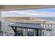 Balcony with a table and chairs overlooking the city skyline and ocean view at 5905 S Kings Highway # 1117, Myrtle Beach, SC 29575