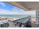 Balcony with table and chairs overlooking the beautiful beach and ocean view at 5905 S Kings Highway # 1117, Myrtle Beach, SC 29575