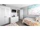 Bedroom featuring two twin beds, dresser with wall-mounted TV, and closet at 5905 S Kings Highway # 1117, Myrtle Beach, SC 29575