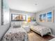 Cozy bedroom featuring two twin beds, beach themed art and a dresser at 5905 S Kings Highway # 1117, Myrtle Beach, SC 29575
