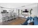 Open-concept living space featuring a kitchen bar, seamlessly connecting the kitchen and living area at 5905 S Kings Highway # 1117, Myrtle Beach, SC 29575