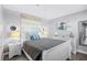 Comfortable bedroom with a queen bed, coastal decor, and matching white nightstands at 5905 S Kings Highway # 1117, Myrtle Beach, SC 29575