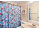 Charming bathroom features flamingo themed shower curtain and bright lighting at 6000 N Ocean Blvd. # 131, North Myrtle Beach, SC 29582