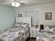 Guest bedroom with two twin beds, coastal decor, and comfortable accommodations at 6000 N Ocean Blvd. # 131, North Myrtle Beach, SC 29582