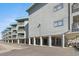 Exterior elevation of condo building showing ground level parking and multiple floors of balconies at 6000 N Ocean Blvd. # 131, North Myrtle Beach, SC 29582
