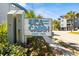 Community sign 'Sea Cabin Cherry Grove' nestled in flowers and greenery on a sunny day at 6000 N Ocean Blvd. # 131, North Myrtle Beach, SC 29582