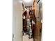A utility closet featuring a water heater, shelving, and other home maintenance equipment at 6000 N Ocean Blvd. # 131, North Myrtle Beach, SC 29582