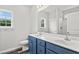 Bathroom with double vanity, blue cabinets, and a walk-in shower at 85 Millsite Ct., Georgetown, SC 29440