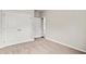 Well-lit bedroom featuring double doors and carpet at 85 Millsite Ct., Georgetown, SC 29440