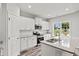 Modern kitchen with white cabinets, granite countertops, and stainless steel appliances at 85 Millsite Ct., Georgetown, SC 29440