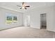 Spacious main bedroom with carpeted floors and walk-in closet at 85 Millsite Ct., Georgetown, SC 29440