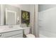 Well-lit bathroom with a vanity, a large mirror, and a shower with tub at 120 Fair Meadow Ct., Loris, SC 29569