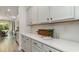 Contemporary kitchen with white countertops and cabinets, complete with modern appliances at 120 Fair Meadow Ct., Loris, SC 29569