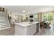 Open-concept kitchen with island flowing into the living area, perfect for entertaining and Gathering gatherings at 120 Fair Meadow Ct., Loris, SC 29569