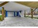 View of the spacious covered parking area under the stilt home with a garage and staircase at 721 10Th Ave. S, Surfside Beach, SC 29575