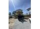 Framing stage of construction of stilt home with protective wrap around sheathing at 721 10Th Ave. S, Surfside Beach, SC 29575