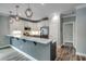 Bright kitchen featuring stainless steel appliances, white cabinets, and breakfast bar seating at 721 10Th Ave. S, Surfside Beach, SC 29575