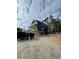 New construction home with siding and framed porch with dumpster in foreground at 723 10Th Ave. S, Surfside Beach, SC 29575