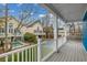 An outdoor deck features white railings and a backyard view of a pool and nearby houses at 723 10Th Ave. S, Surfside Beach, SC 29575