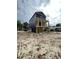 Home under construction with blue siding and a partially built porch, showing the progress and potential of the property at 723 10Th Ave. S, Surfside Beach, SC 29575