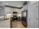 Modern kitchen with stainless steel appliances, white cabinetry, and a breakfast bar at 723 10Th Ave. S, Surfside Beach, SC 29575