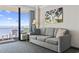 Cozy living room with a comfortable sofa and balcony access, offering stunning ocean views at 1105 S Ocean Blvd. # 904, Myrtle Beach, SC 29577
