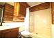 Bathroom featuring a stall shower and wood-paneled walls at 1131 White Tree Ln. # 31-J, Myrtle Beach, SC 29588