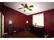 Bedroom with hardwood floors, ceiling fan, and burgundy accent wall at 1131 White Tree Ln. # 31-J, Myrtle Beach, SC 29588