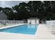 Community pool with lounge chairs and fenced-in area at 1131 White Tree Ln. # 31-J, Myrtle Beach, SC 29588