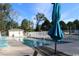 Community pool area with lounge chairs and shade umbrella at 1131 White Tree Ln. # 31-J, Myrtle Beach, SC 29588