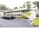 Inviting two-story condo with well-maintained landscaping and convenient parking at 1131 White Tree Ln. # 31-J, Myrtle Beach, SC 29588