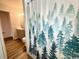 Bathroom with shower stall and forest-themed shower curtain at 10301 N Kings Highway # 15-8, Myrtle Beach, SC 29572