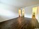 Bright bedroom with dark brown wood-look vinyl flooring and ample closet space at 10301 N Kings Highway # 15-8, Myrtle Beach, SC 29572