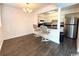 Dining area with laminate flooring and kitchen access at 10301 N Kings Highway # 15-8, Myrtle Beach, SC 29572