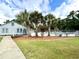 Community pool with palm trees and surrounding landscape at 10301 N Kings Highway # 15-8, Myrtle Beach, SC 29572