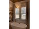 Relaxing bathroom with free-standing tub and large windows at 206 Green Lake Dr., Myrtle Beach, SC 29572