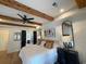 Main bedroom with hardwood floors, exposed beams, and ensuite bathroom at 206 Green Lake Dr., Myrtle Beach, SC 29572